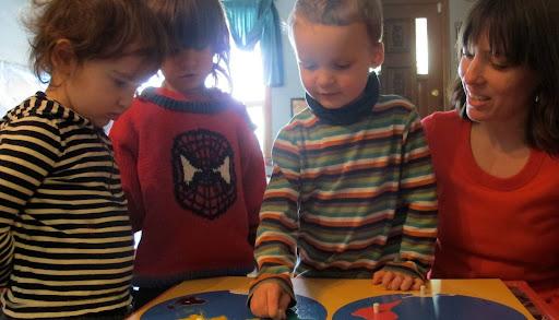 Kids playing with a teacher